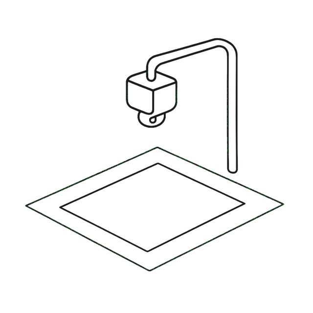 Line drawing of a sheet of paper under an overhead camera arm, a scan field marked around it